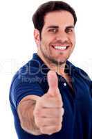 young man gesturing thumbs up