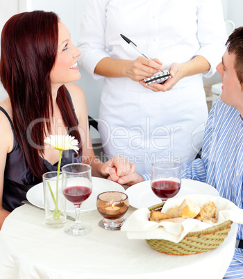 Attractive couple having dinner at the restaurant