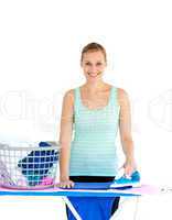 Joyful woman ironing her clothes