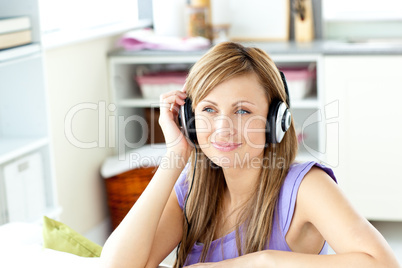 Kind woman listening to music at home
