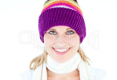 Glowing young woman wearing white pullover and colorful hat