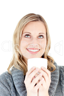 Thoughtful woman enjoying a hot coffee standing
