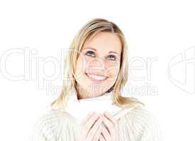 Smiling woman enjoying a hot coffee standing