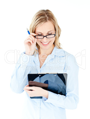 Glowing businesswoman wearing glasses and holding a clipboard