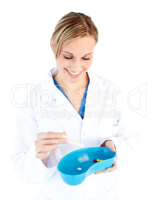 Charismatic female doctor holding capsule