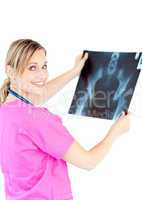 Serious female doctor looking at a x-ray