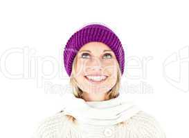 Bright woman with a colorful hat and a pullover looking upwards