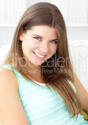 Portrait of a bright caucasian woman looking at camera and sttin