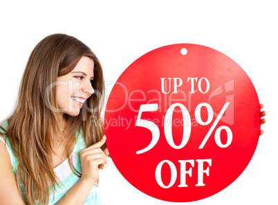 Bright caucasian woman holding a "up to 50% off" red banner