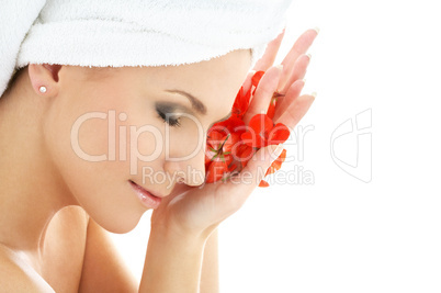happy woman with red flower petals