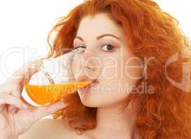 lovely redhead drinking orange juice