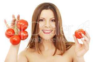 beautiful brunette girl holding tomatos