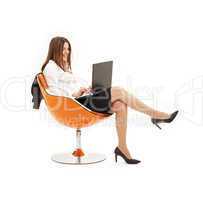 businesswoman with laptop in orange chair