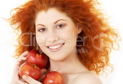 happy redhead with red apples