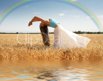 stretching woman with rainbow and water