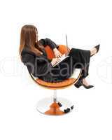 elegant businesswoman with laptop in orange chair