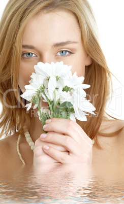 girl with white chrysanthemum in water