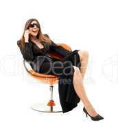 businesswoman with phone in orange chair #2