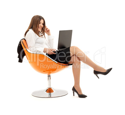 businesswoman with laptop in orange chair #2
