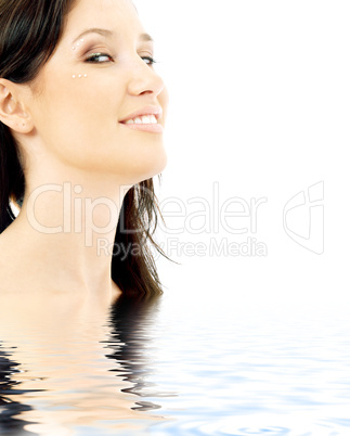 smiling brunette with diamond make-up in water