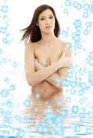 long hair brunette in water with flowers
