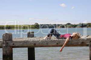 Girl relaxing at landing stage in France
