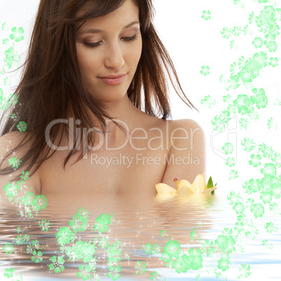 brunette with yellow lily and flowers in water