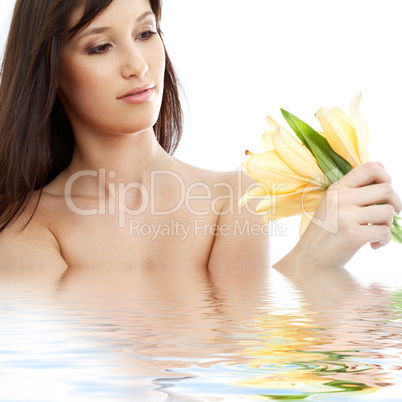 happy brunette with yellow lily flowers in water #2