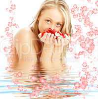 blond with red and white rose petals and flowers in water