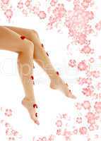beautiful legs with flowers in spa