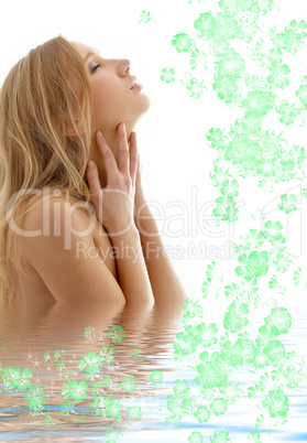 healthy blond with closed eyes in water