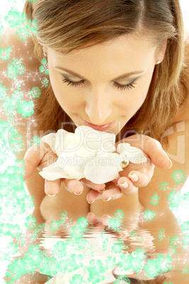 smelling rose petals in water with flowers