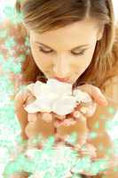 smelling rose petals in water with flowers