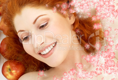 lovely redhead with red apples and flowers