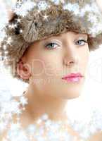 lovely beauty in winter hat with snowflakes