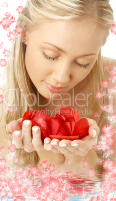 lovely blond in water with red rose petals