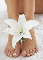 feet with white lily