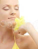 portrait of girl with yellow feathers