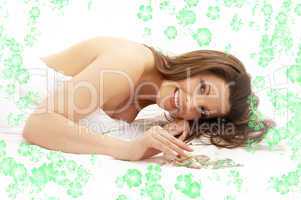 happy brunette in spa with flowers