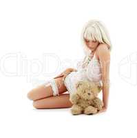 sad blond with teddy bear