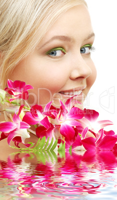 lovely blond with orchid in water