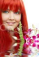 lovely redhead with orchid in water