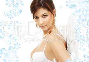 portrait of brunette angel girl with snowflakes