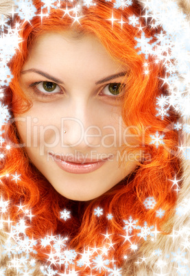 lovely redhead in fur with snowflakes