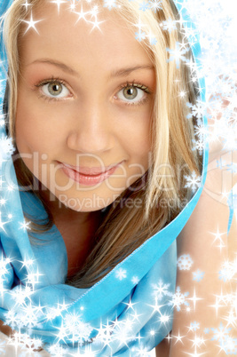 smiling blond in blue scarf with snowflakes