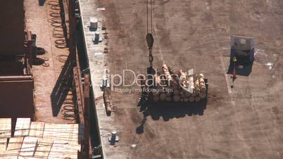 Logs lifted onto ship