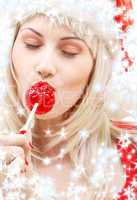 santa helper with lollipop and snowflakes