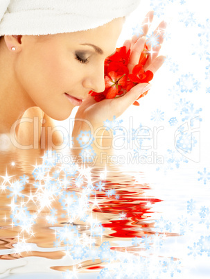 lady with red petals and snowflakes in water