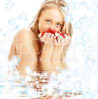 blond with rose petals and snowflakes in water