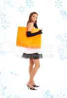 elegant lady with orange shopping bag and snowflakes